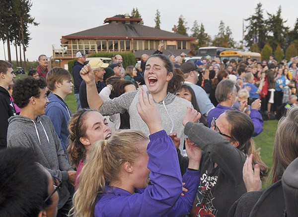 Someone excited about a league title? Sequim High School's Elizabeth Rosales and teammates are