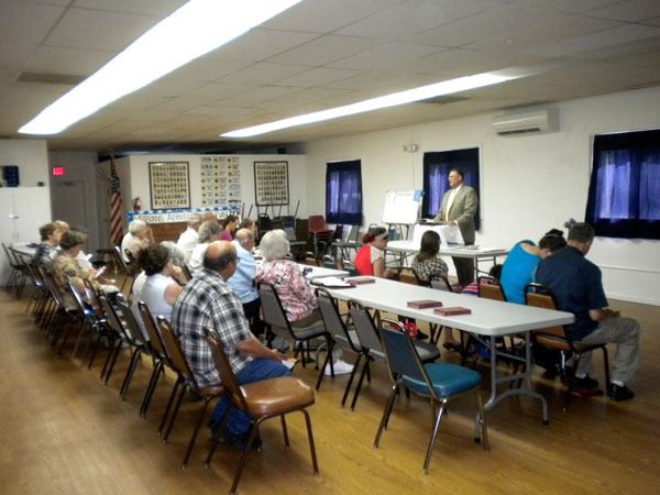 Pastor Jerry MacDonald leads the Church of Christ in Sequim’s first Sunday service in late July. Services continue at 10 a.m. Sundays at the American Legion Hall.