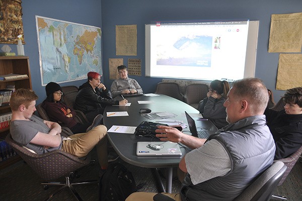 History teacher Craig Frick of Sequim leads a current events discussion at the Jefferson Community School last week.