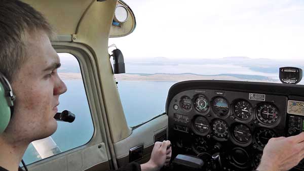 Senior soaring through the air and water