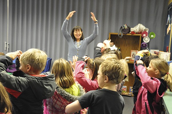 Monique Brasher and her first-graders sing the “Itsy Bitsy Spider” song for the First Teacher families.