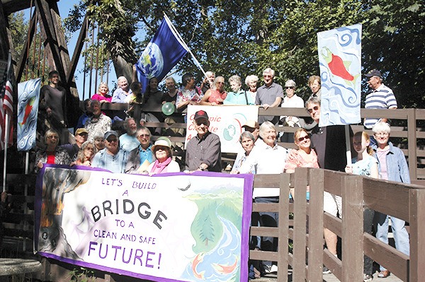 A standing room only crowd gathers near the Dungeness River Audubon Center on Saturday