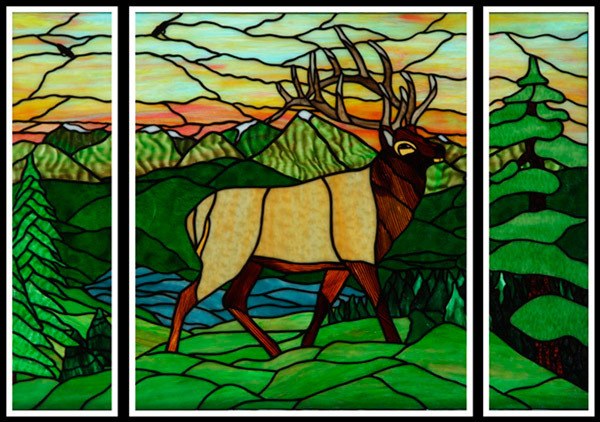 A miniature version of a leaded glass elk art window by local artist Mille Harrell is now on display in the Blue Whole Gallery