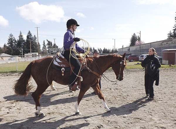 Sequim Equestrian team newcomer Amy Tucker rides to a third-place finish in Working Rancher. Because her own horse is inexperienced