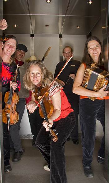 The members of Whozyamama bring their traditional Cajun music to the grassy courtyard at the Port Angeles Library