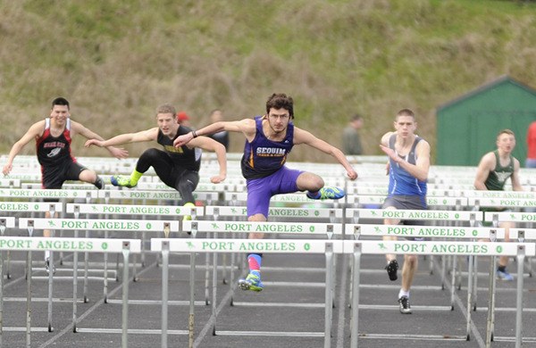 Sequim's Oscar Herrera competes in the 110-meter high hurdles at the Port Angeles Invitational in march.