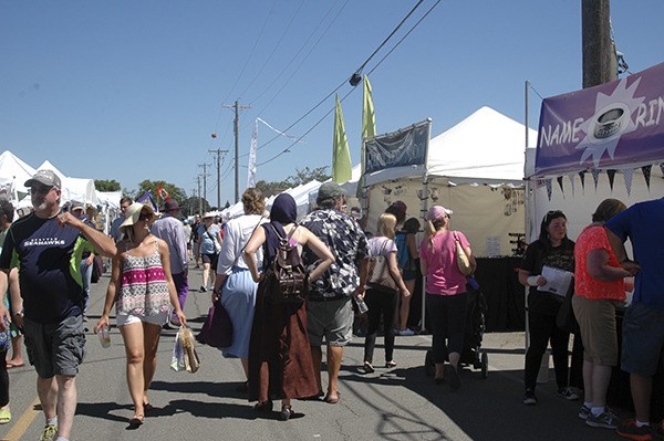 Lavender Weekend festival goers enjoy the street fair in downtown Sequim in 2015.