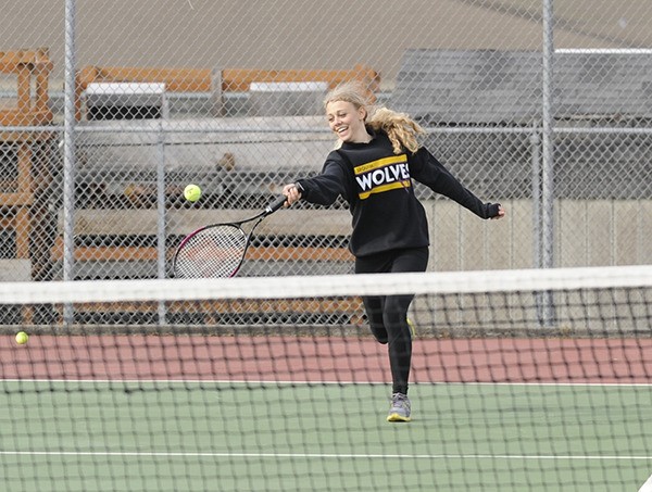 Sequim's Alina Moeller returns a volley as Sequim battles Olympic on April 10.