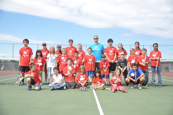 Attendees of the Sequim Boys & Girls Club Tennis Camp enjoy a sunny day of learning about the game recently at the Sequim High School courts.