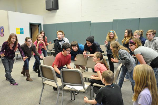 The entire cast leans in to earnestly advise Eric the Prince to “Kiss the Girl” during rehearsals for Sequim Middle School’s production of Disney’s “The Little Mermaid