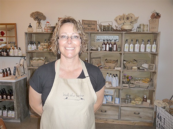 Kristi Grasser has a large offering of bath and beauty products under her proprietary brand of Birds of a Feather Farm. At left is an old farm sink where customers can try on several scents.