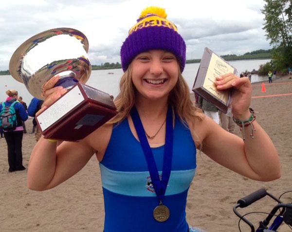 Sequim’s Elise Beuke shows off her championship trophy from the USRowing Northwest Youth Regional Championships.