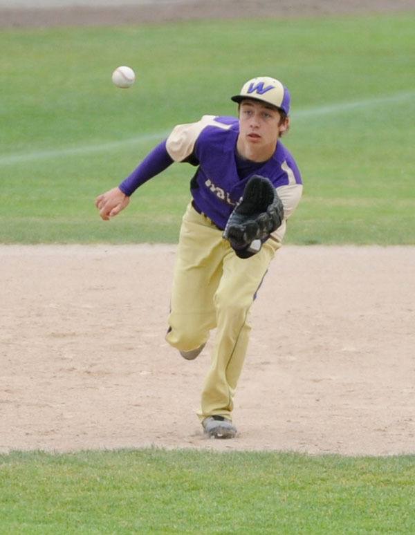 Sequim third baseman Austin Hilliard keeps his eye on a ground ball in the first inning of the Wolves 5-2 loss to North Kitsap on May 16.