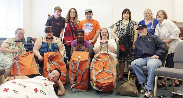 Participants and volunteers with Clallam Mosaic’s Safe & Strong class participate in a recent emergency preparedness course. Organizers with Mosaic said they seek funding to purchase property and build a community for people with developmental disabilities.