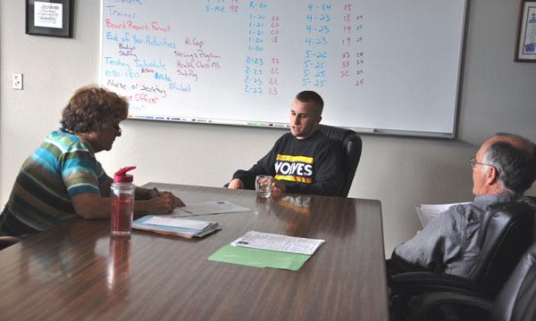 Sequim School Board directors John Bridge and Bev Horan interview sophomore Ben Hughes for the role of student representative in early June. The board selected Hughes to serve alongside Kailee Price