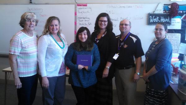 Helping to celebrate the graduation of a Sequim Options student are (from left) school board president Beverly Horan