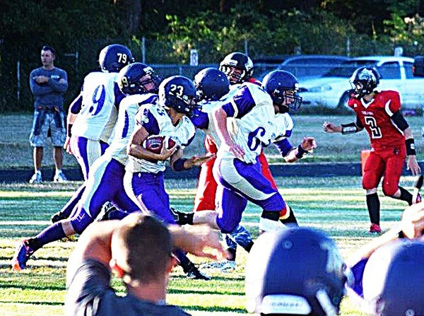 Sequim back Ty Jones rushes for a big gain as the Wolves take on Coupeville on Sept. 12.