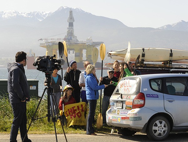 Surrounded by a handful of fellow protestors with the Shell No Action Coalition