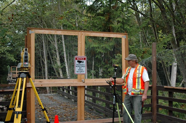 Carefully marking the horizontal and vertical controls needed to accurately layout and thus construct the bridge