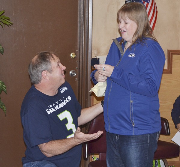 Greg Roberts proposes to girlfriend Amber Hansen at a meeting of the Dungeness Bay Sea Hawkers on Nov. 19.