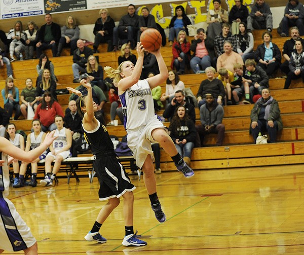 Sequim's Hailey Lester drives to the hoop for a basket in a game against bremerton earlier this season. Sequim's season ended Monday night with a loss in the West Central District tournament to River Ridge.