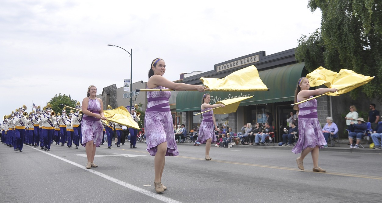 Sequim High School’s Color Guard performs for the Irrigation Festival Grand Parade crowd in May 2016. Sequim Gazette file photo by Michael Dashiell