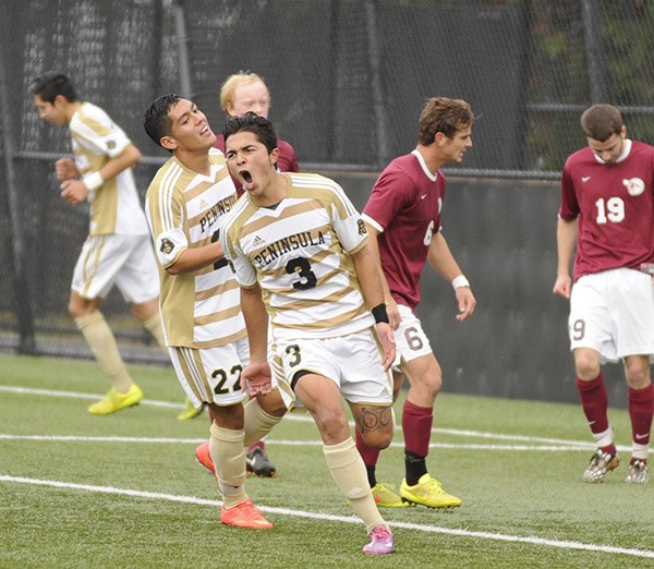 Peninsula’s Julio Soto reacts to a score as Peninsula knocks off Pierce 3-0 in a NWAC first round game on Nov. 5 in Port Angeles.