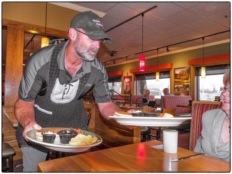 Member Marc Connelly serves up some food at the Sequim Picklers fundraiser. Photo by Bob Lampert