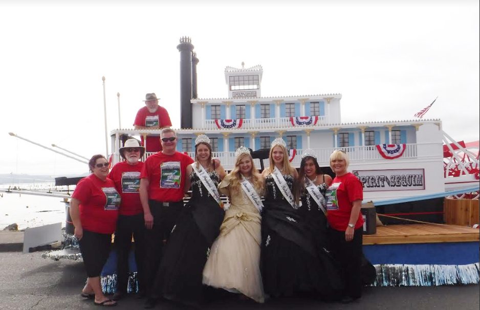 Sequim Irrigation Festival Royalty and float helpers celebrate their three awards at Hoquiam's Loggers Playday on Sept. 10. The float won “Judge’s Choice — Best Overall Categories