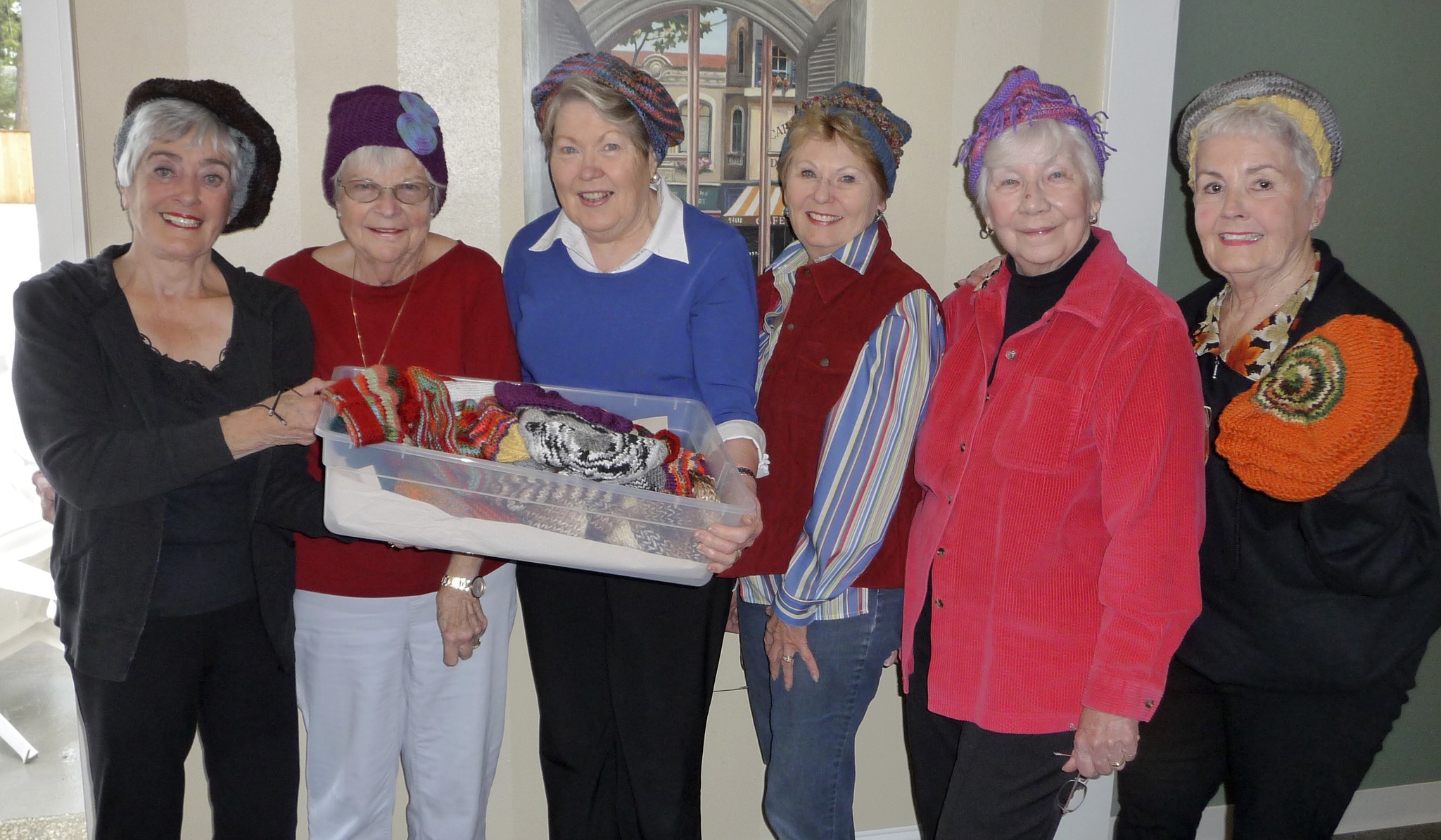 A group of Sequim's Mad Hatters gathers to sport hand-knit hats in styles from tams to ski hats all made by hand by Joanne Eriksen and donated to patients receiving chemotherapy at Olympic Medical Cancer Center. The hats have intricate patterns and a wide mix/match of colors. From left are Thelma Sullock