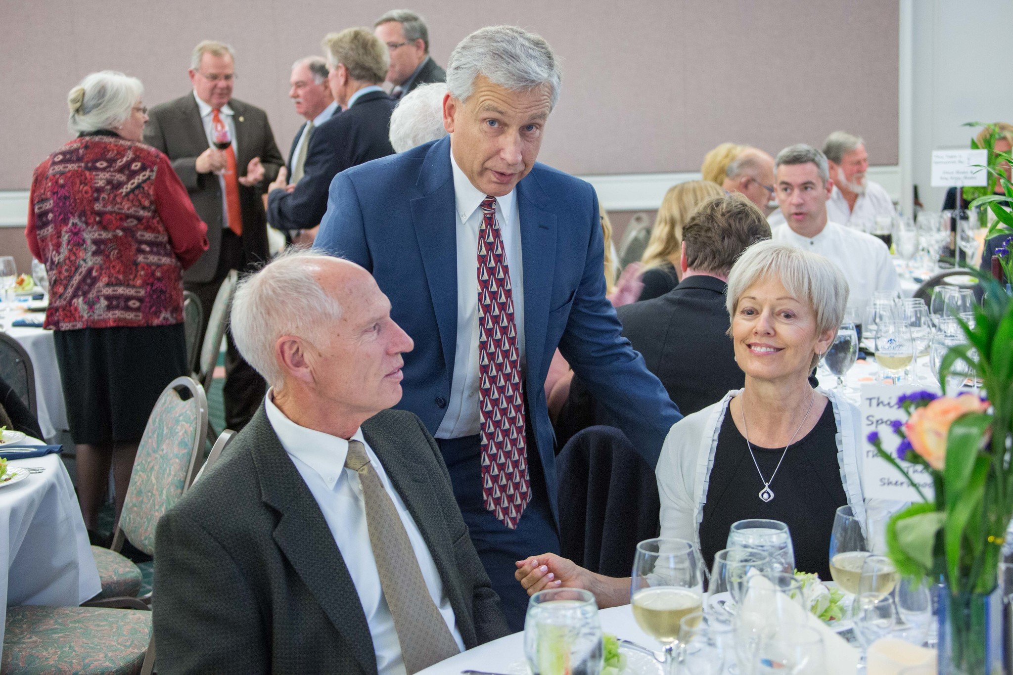 Bill and Esther Littlejohn (seated) talk with Olympic Medical Center CEO Eric Lewis at the Harvest of Hope event on Oct. 15. The Littlejohns donated $100