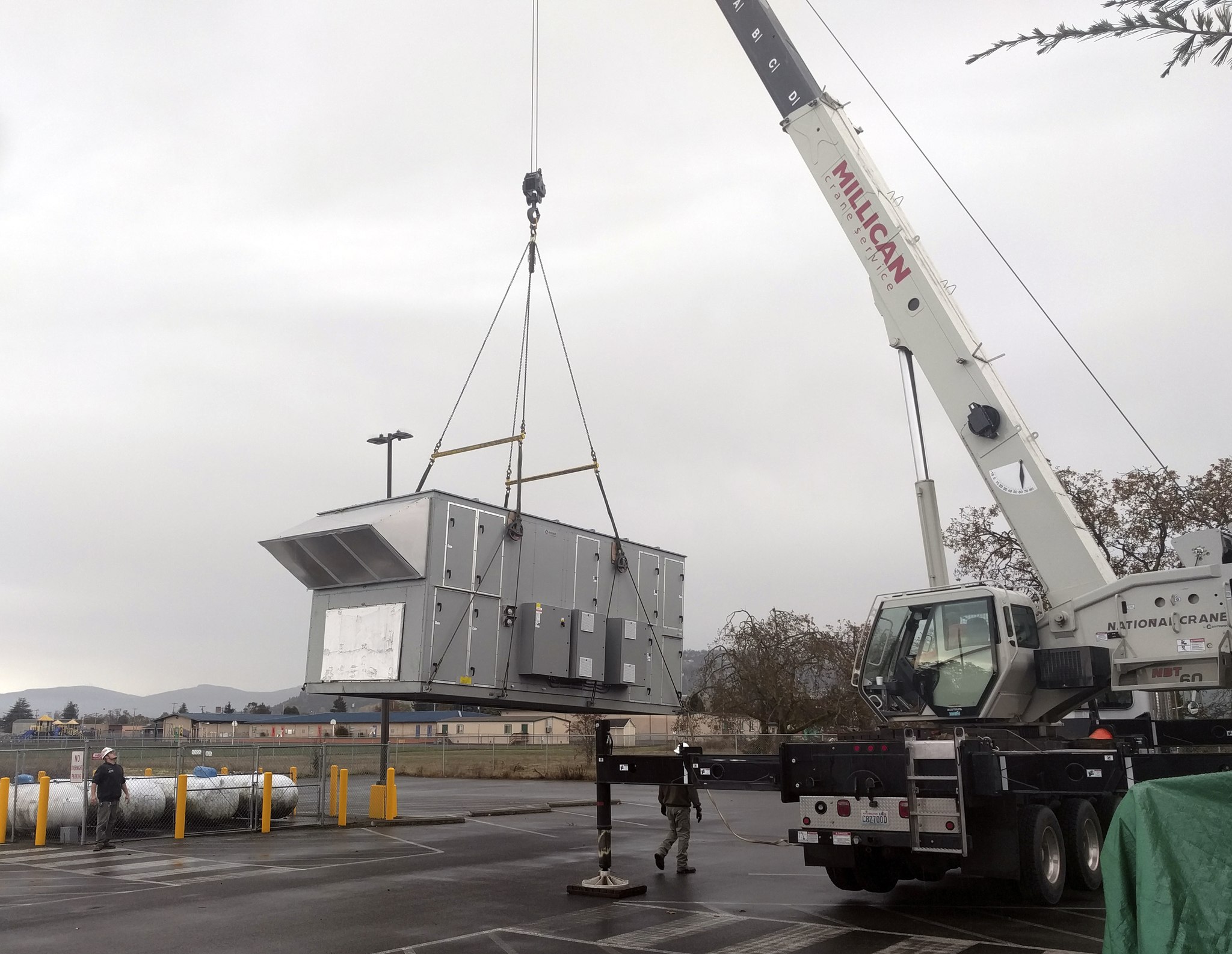 Construction crews unload an air handler at YMCA of Sequim on Oct. 17. Photo by Frank Pickering