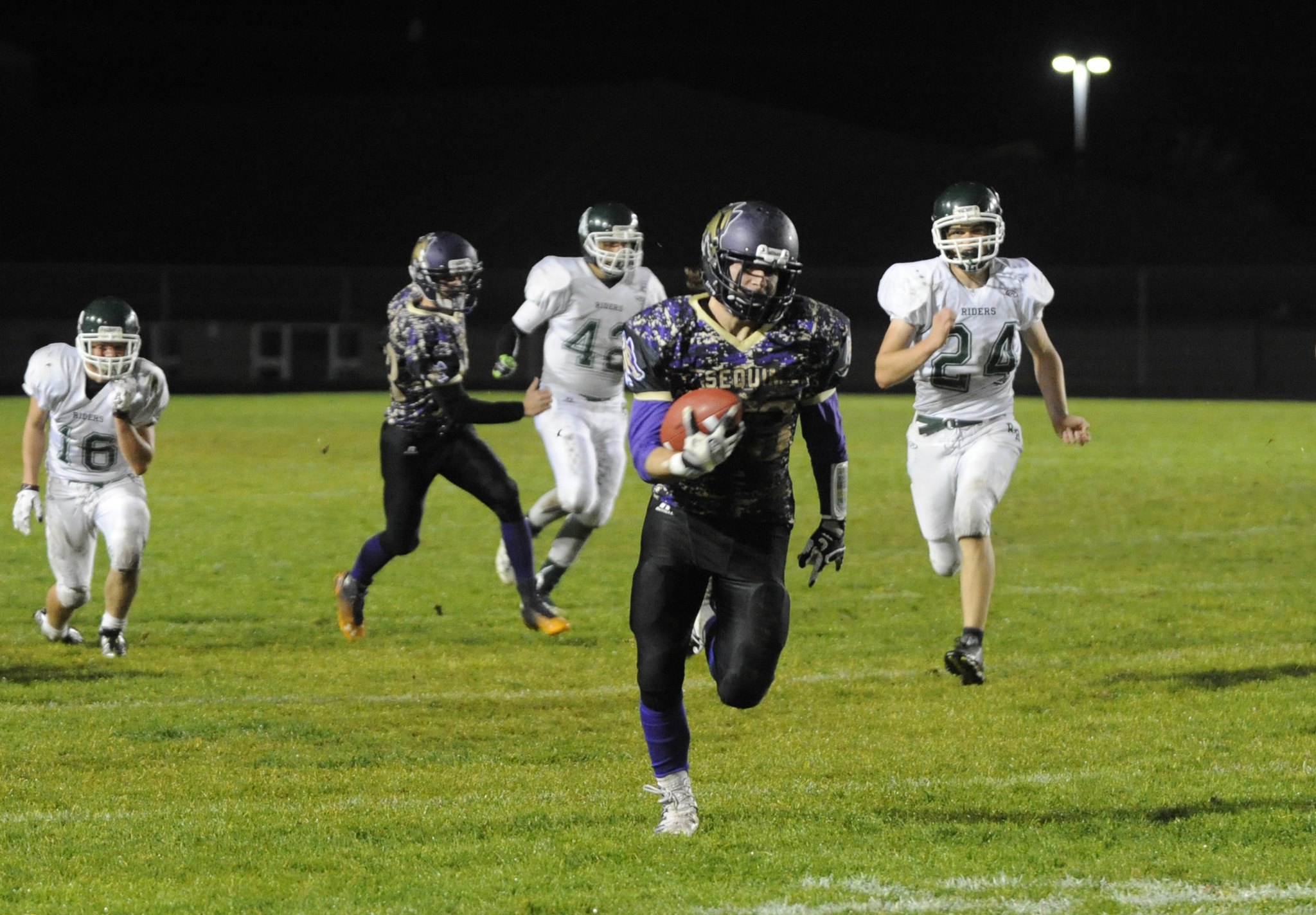 Sequim's Gavin Velarde races in for one of his four touchdowns as the Wolves rout Port Angeles 49-9 on Oct. 21. Sequim Gazette photo by Michael Dashiell