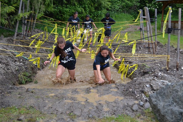 Participants slosh through the 2015 Zombie Mud Run at Peninsula College