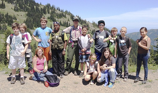 Junior Rangers get a great view from atop Hurricane Ridge Hill.