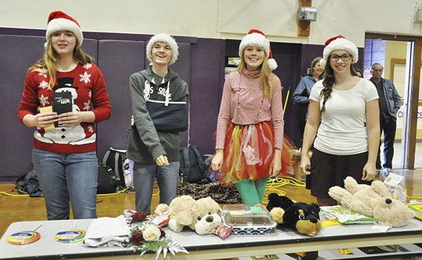 Santa’s helpers at Sequim High School’s recent Winter Wishes assembly include