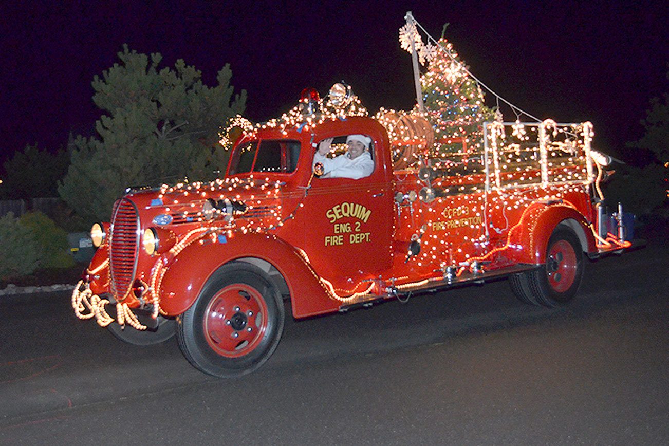 Leonard Horst, District 3 firefighter/paramedic and Explorer Post 1003 advisor, serves as one of Santa’s elves during last year’s Santa’s Toy and Food Fire Brigade. Submitted photo