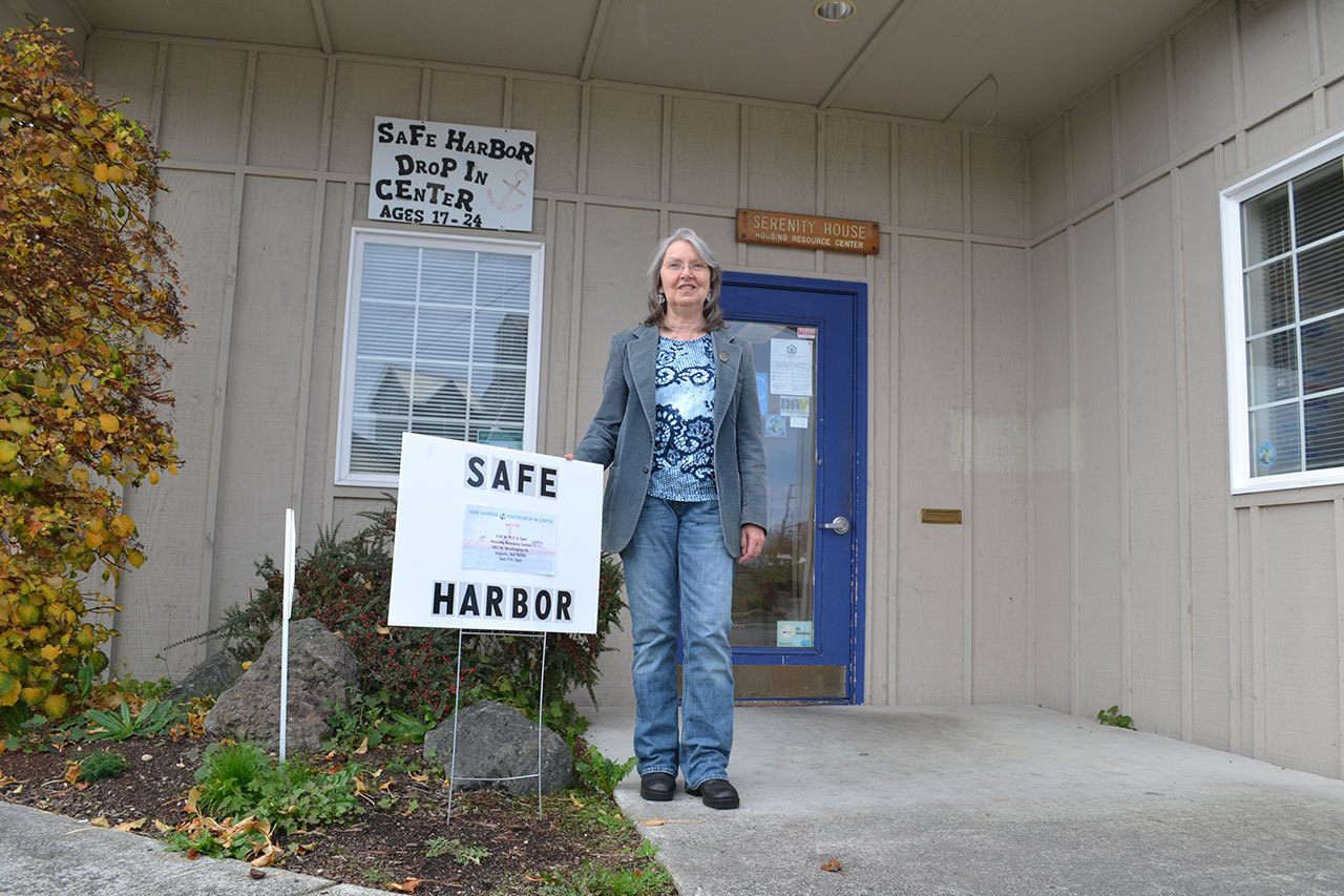 Cecilia Eckerson, lead volunteer for Safe Harbor Drop-In Center, stands outside the facility that offers a safe space for young adults ages 17-24 to relax, use computers and get food.