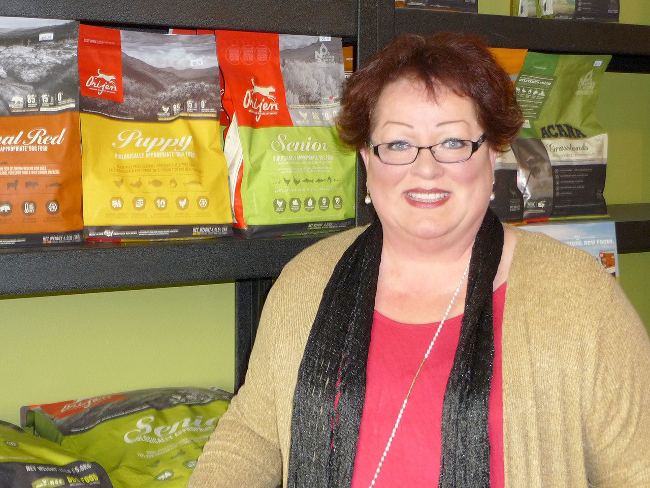 Melinda Olson recently opened an all-natural pet food store, Goin’ to the Dogs … Cats, Too, near Sunny Farms in Sequim. Sequim Gazette photo by Patricia Morrison Coate