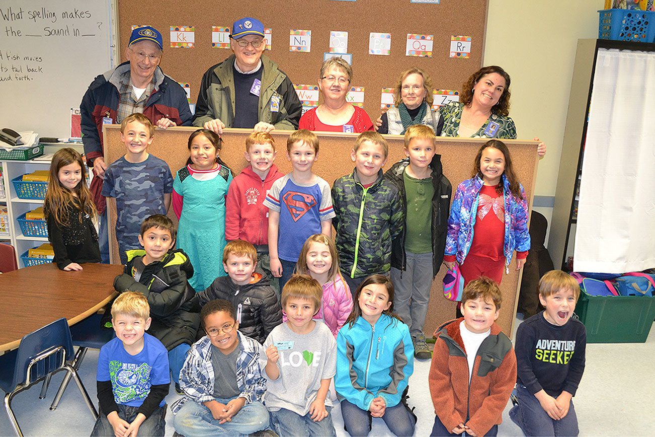 Kiwanis help first-graders with new bulletin boards