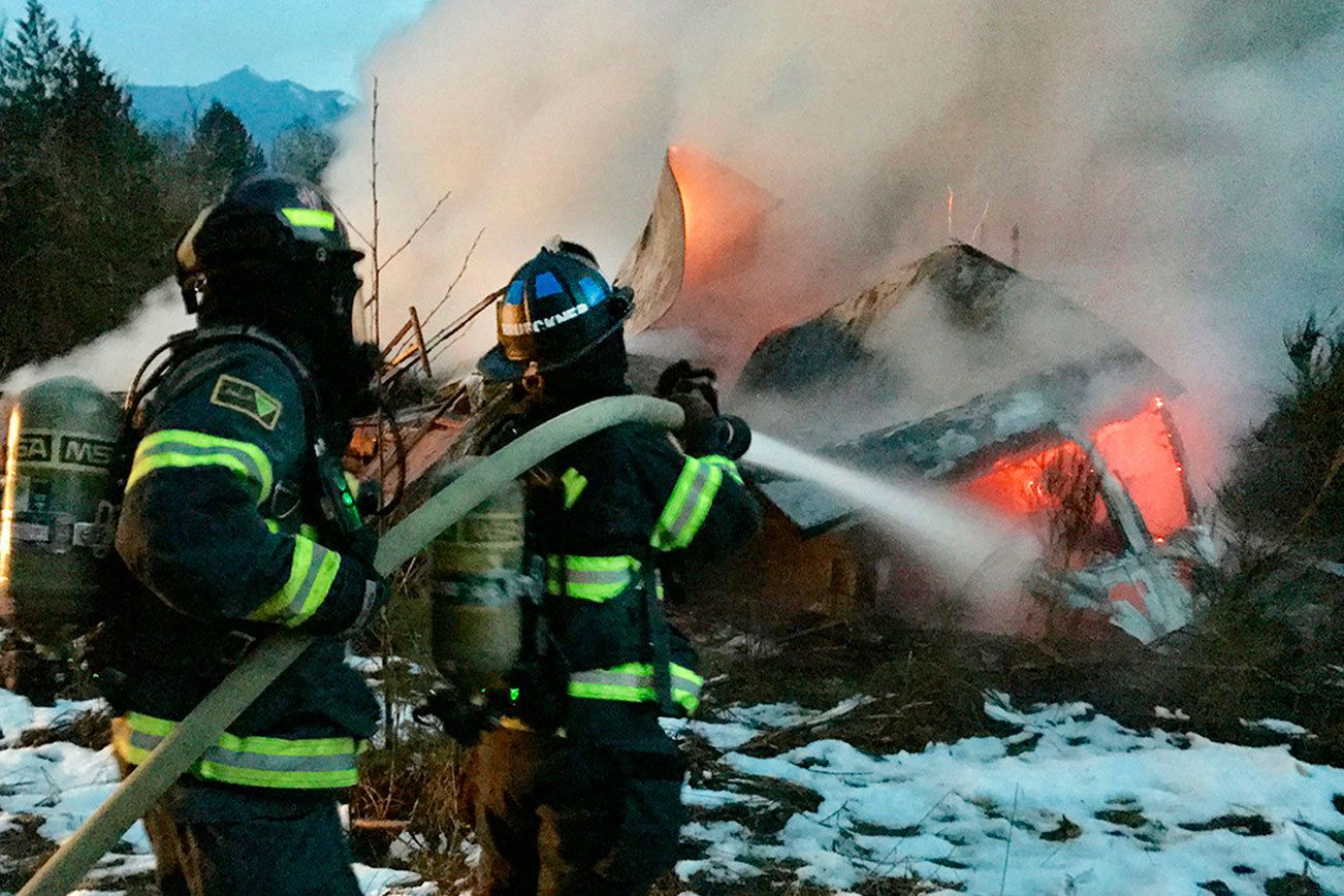 Fire engulfs structure at the old Clallam Timber log yard