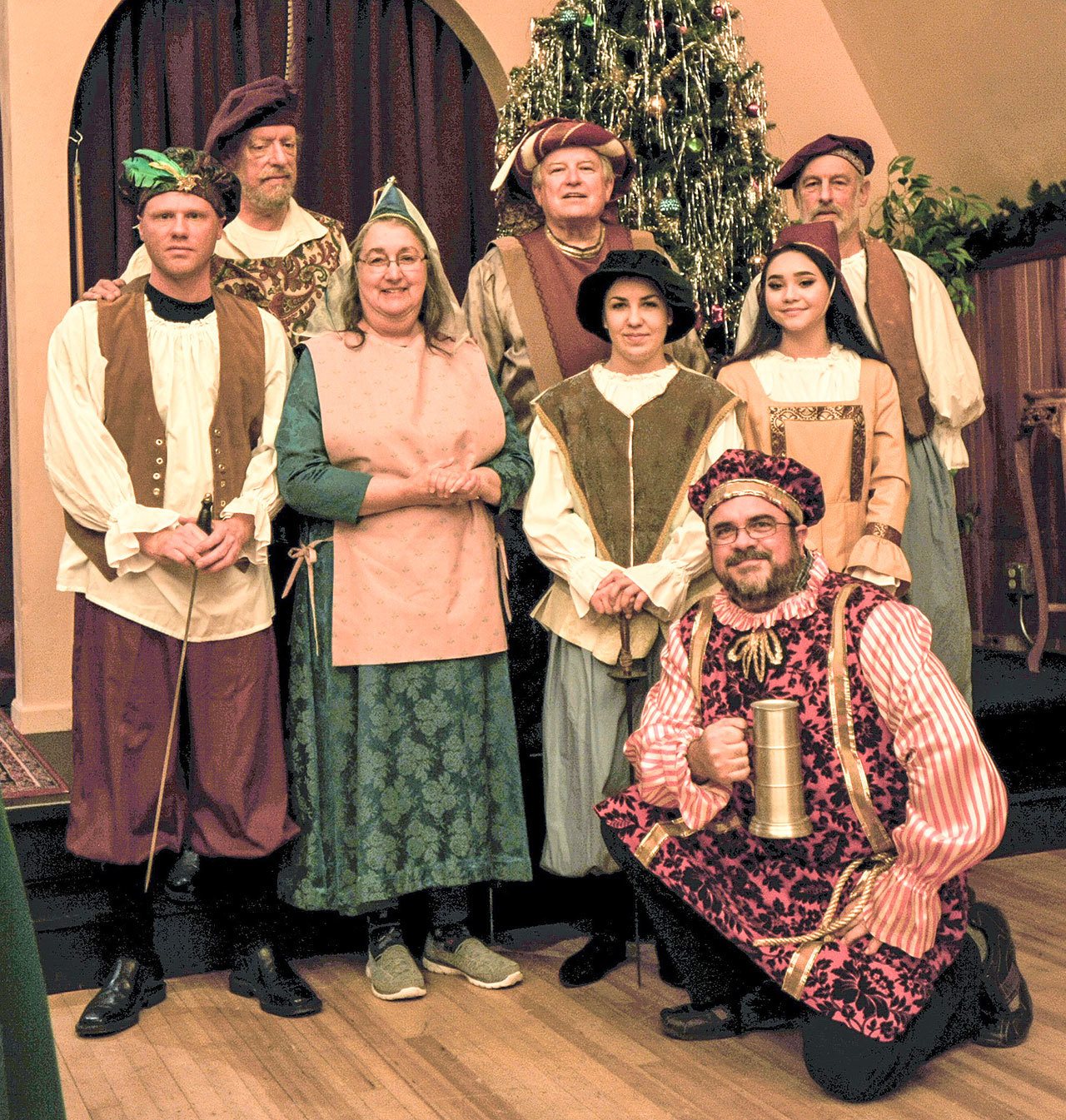 Decked out in their finery are, from left, cast members Jeff Clinton, Carl Honore, Tracy Williams, Rich Hendricksen, Kaylee Ditlifsen, Karl Hatton, Erin Gordon and Allison, who goes by one name only. Submitted photo