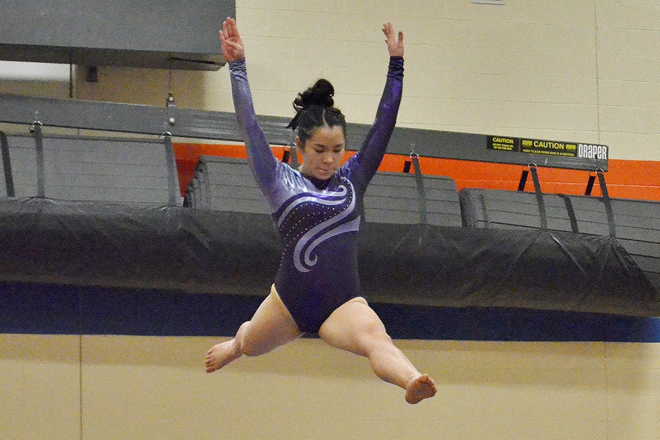 Gymnastics: Sequim’s Pfeffer and Sweet, PA teammates advance to districts