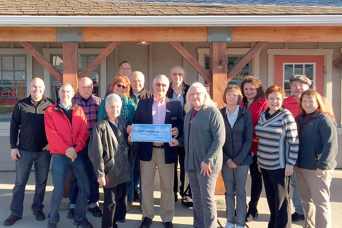 Busines: Brokers donate to Sequim Community Aid