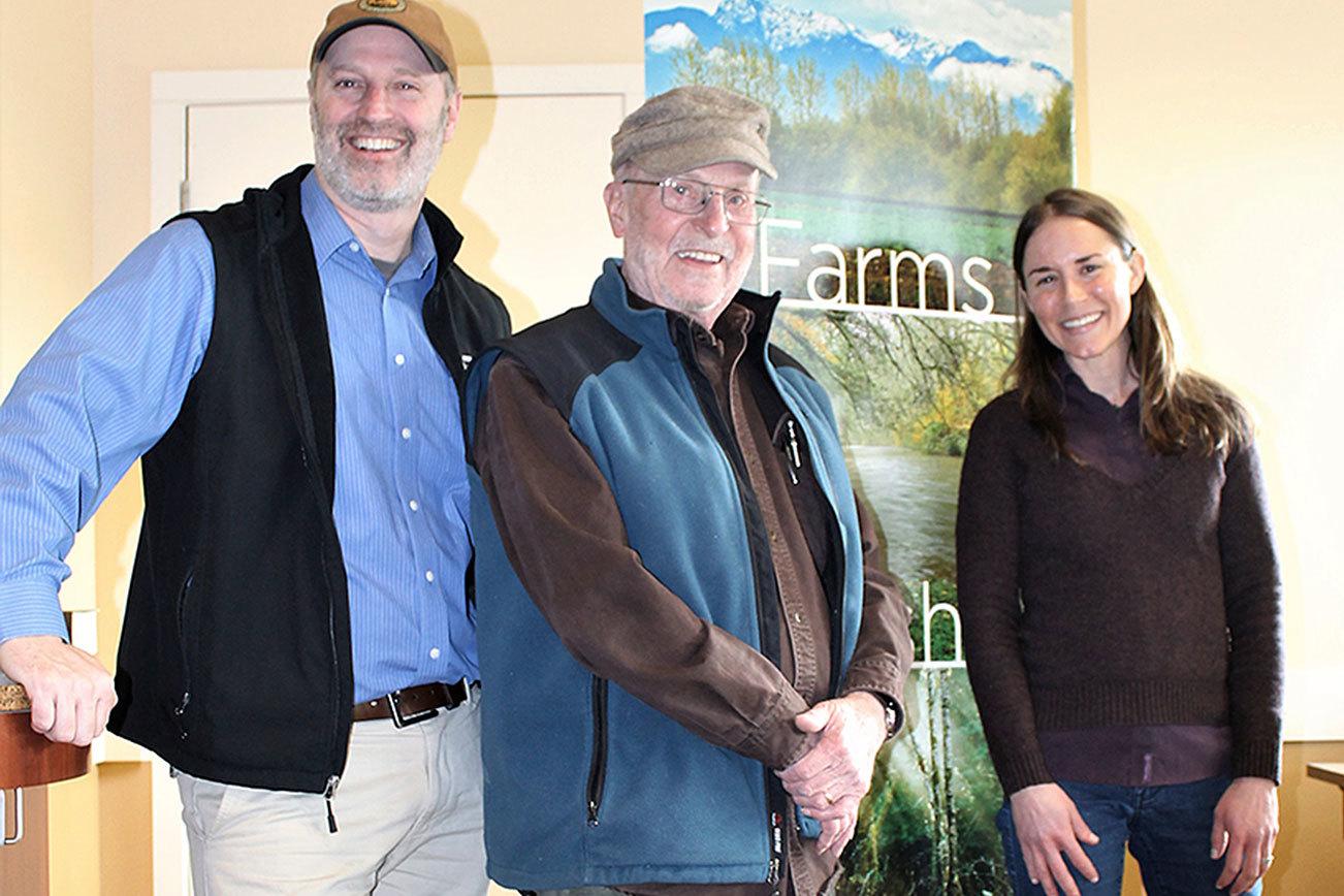 Sixty acres of long-farmed, fertile ground within the Sequim-Dungeness Valley is no longer at risk of being anything but a space for local agriculture.                                 Steve Vause, landowner and president of the 159-year-old Historic Ward Farm’s group of stakeholders, signed the final document needed to confirm a conservation partnership with North Olympic Land Trust on Feb. 2.                                 Although the farm came under contract for conservation in late November, the successful effort by Land Trust officials to conserve the farm, which is among the few large swaths of farmland remaining in Clallam County, was a multi-year process that relied on both state and community support.                                 “The importance of local farmland is something we (farm’s stakeholders) all share,” Vause said. “It’s exciting to know this historic farm will always be available for agriculture.”                                 From left are Tom Sanford, North Olympic Land Trust executive director; Steve Vause, landowner; and Michele Canale, North Olympic Land Trust conservation director.