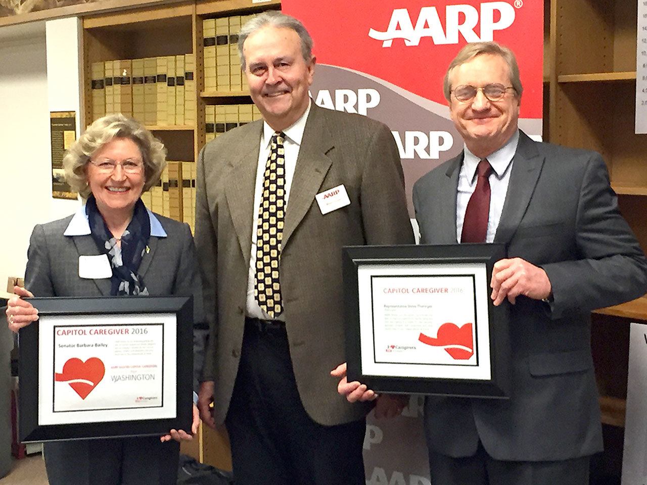 AARP President Mike Tucker (center) presents Sen. Barbara Bailey (left) and Rep. Steve Tharinger with the 2016 “Captiol Caregivers” award. Submitted photo