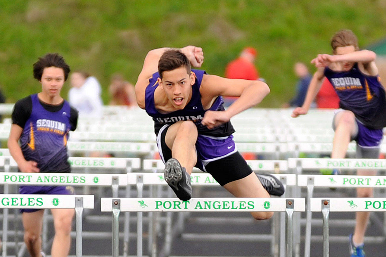 Track & Field: Sequim boys reign in the rain