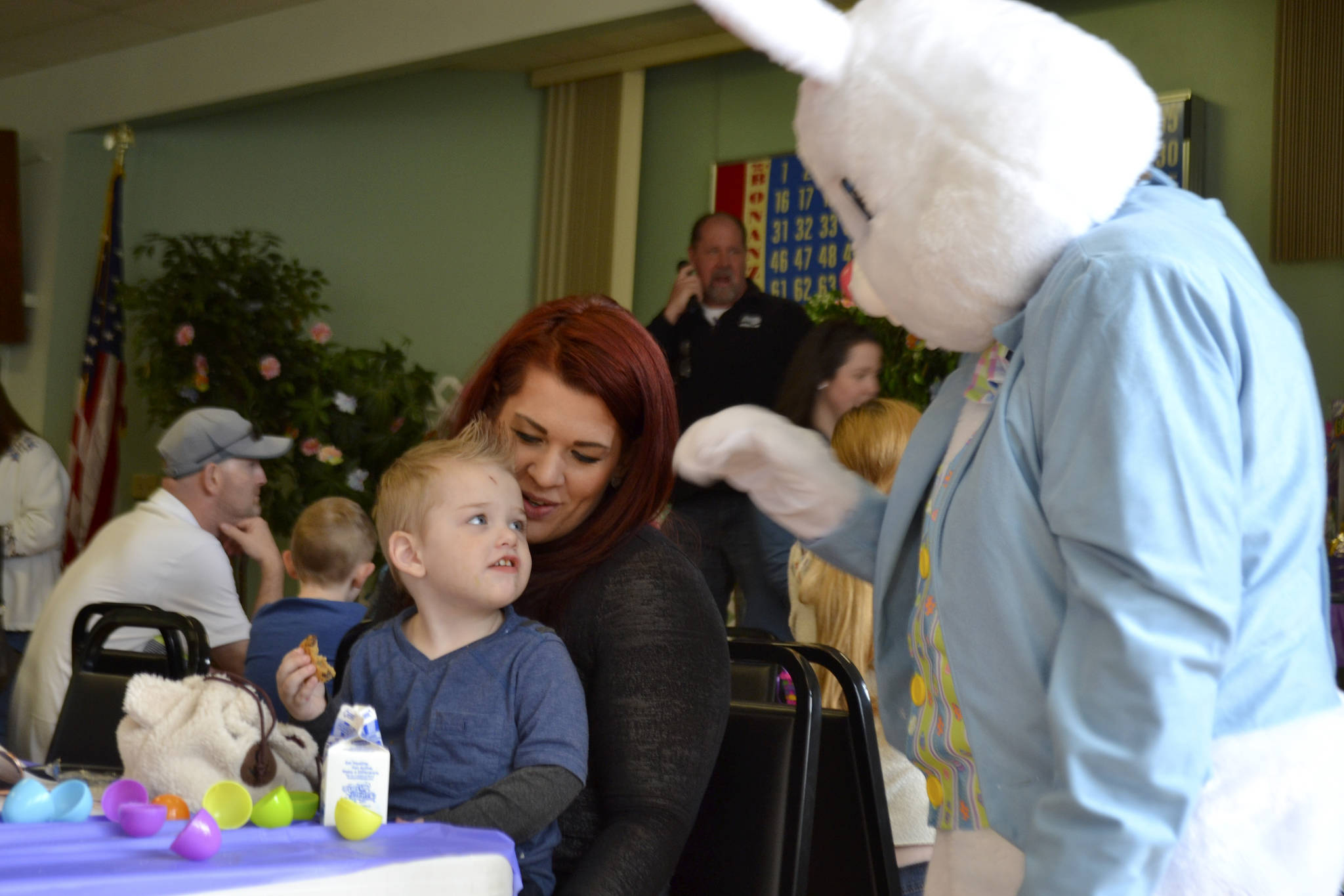 Owen Pickens, 2, and mom Jess Bell greet the Easter Bunny at the Sequim Elks Lodge’s egg hunt event on April 15.