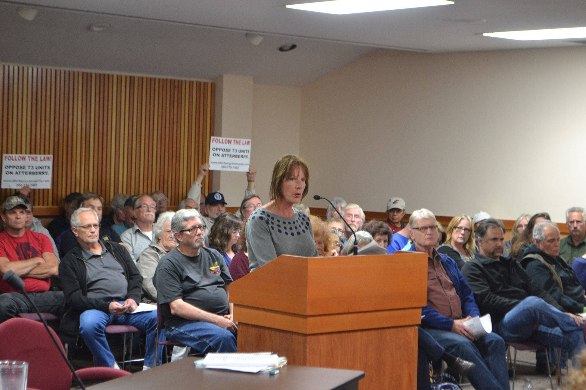 Debra Stevens, a resident on Atterberry Road and retired city planner, speaks during a public comment session on June 1, in the Clallam County Courthouse about a proposed 73-unit manufactured housing development at the intersection of Atterberry and Hooker roads. She said Matriotti Creek should see a buffer of 150 feet due to its classification in Clallam County’s Critical Areas Map and a full environmental review should be done on the site. Sequim Gazette photo by Matthew Nash