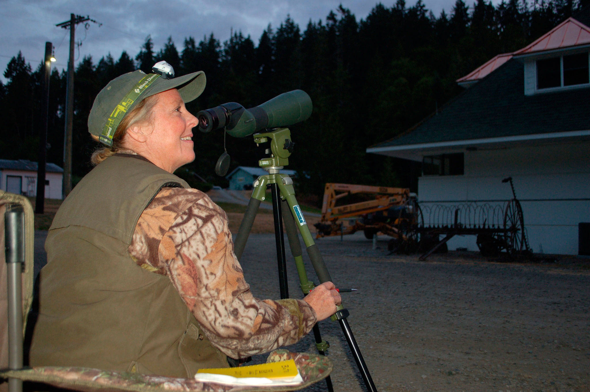 Shelly Ament, Department of Fish and Wildlife assistant district biologist for Clallam and west Jefferson counties, pointed to one of the areas at the Dungeness Fish Hatchery where bats exit the building to hunt for food in the evenings. Ament and others are trying to find where bat populations are located within her district to track any decline in populations that might be affected by white-nose syndrome. Sequim Gazette photo by Erin Hawkins